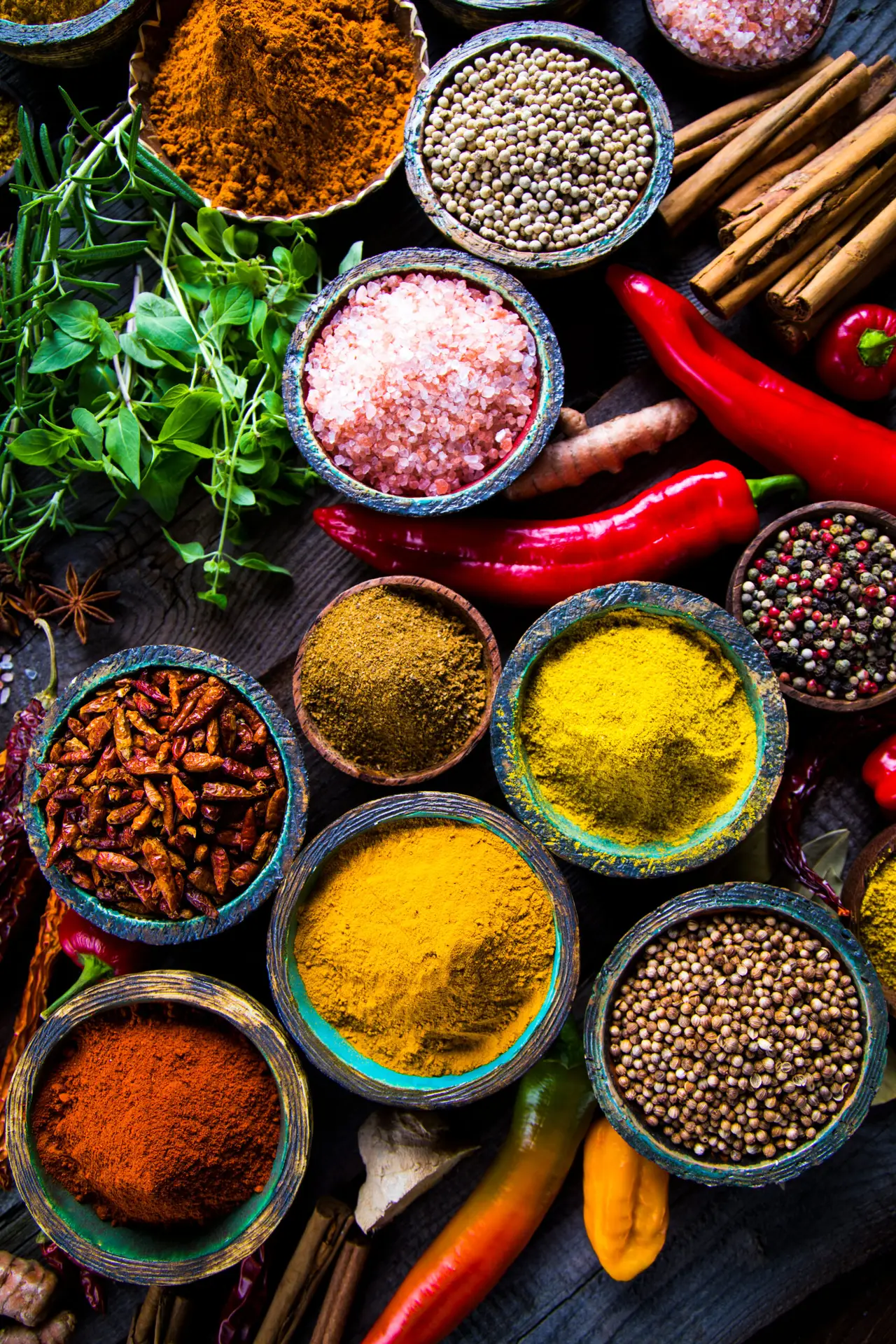 Variety of spices and herbs on kitchen table